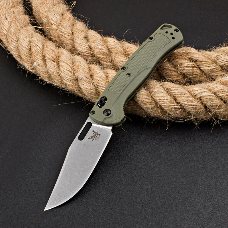 Axis-lock folding knife with fiberglass handle