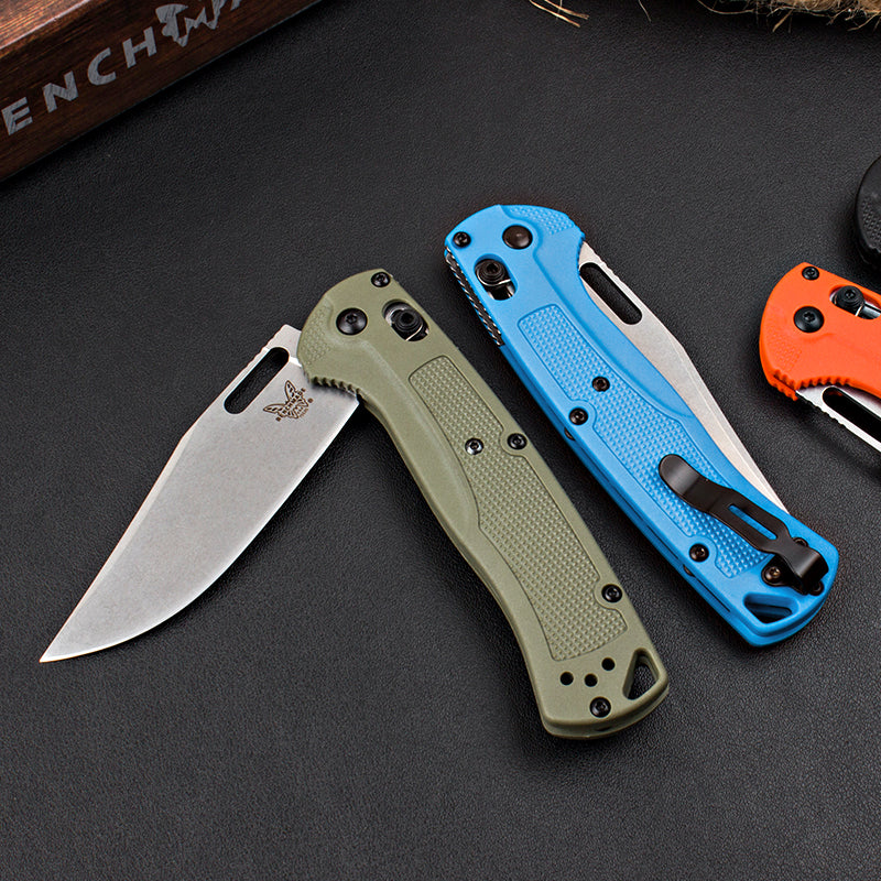 Axis-lock folding knife with fiberglass handle